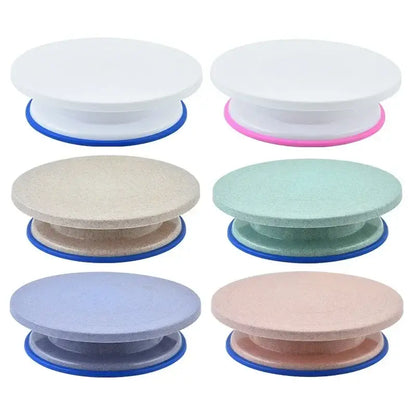Six colorful round plastic cake decorating turntables with blue bases from the decorbites cake decorating set