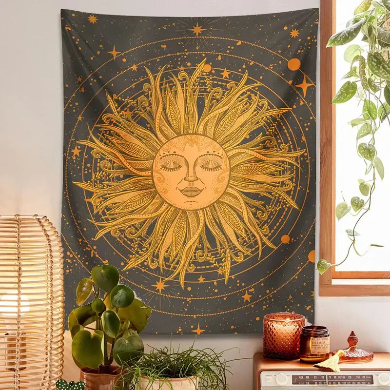 A golden celestial sun with feathered rays and serene face on a 70s retro celestial sun moon wall tapestry bedroom art