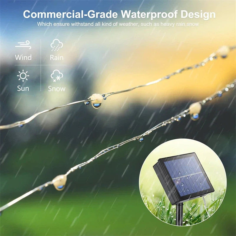 String of solar-powered outdoor led fairy lights with clear water-resistant bulbs and black rectangular solar panel base