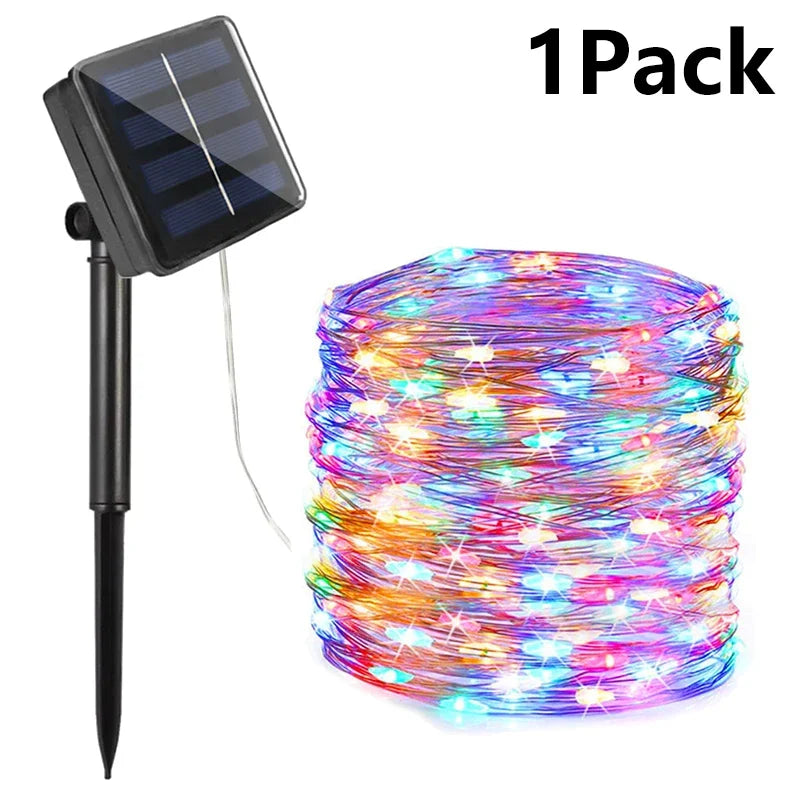 Colorful multi-light solar-powered string fairy lights with black stake and panel for outdoor garden and patio use