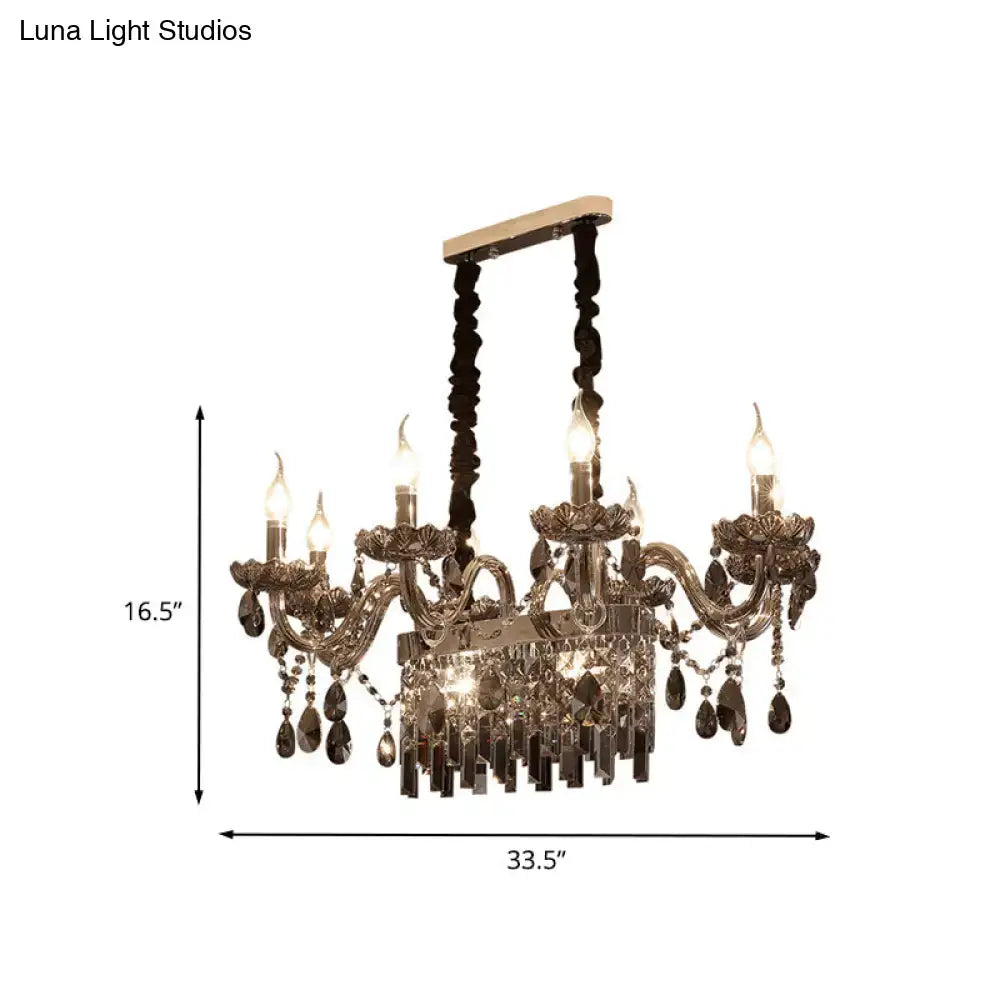 Antique brass DecorBites™ 8-light island pendant with intricate floral arms and smoke gray crystal suspension lighting