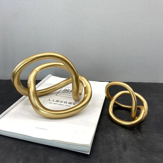 Decorbites™ Goldener Ringknoten Geometrische Harzornamente Handgefertigte Kunstdekoration Figuren