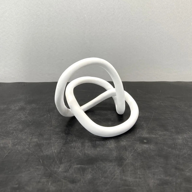 Decorbites™ Goldener Ringknoten Geometrische Harzornamente Handgefertigte Kunstdekoration Figuren