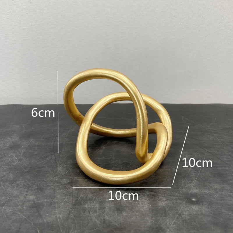 Decorbites™ Goldener Ringknoten Geometrische Harzornamente Handgefertigte Kunstdekoration Figuren