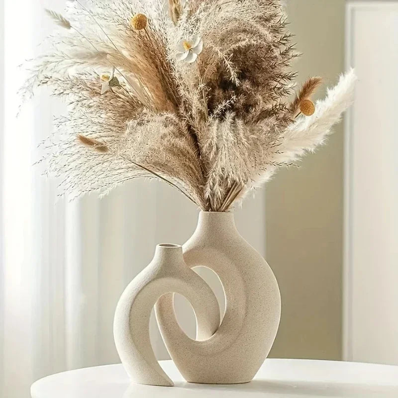 Cream-colored ceramic vase with modern intertwined design and two openings for living room decor made in mainland china
