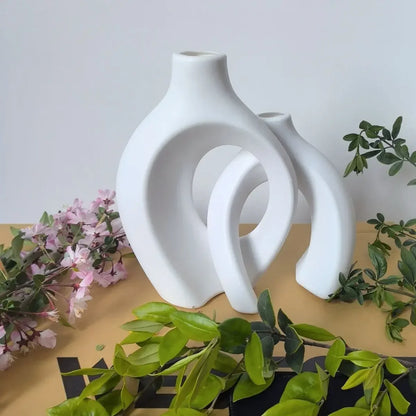White ceramic vase with sleek abstract interlocking curved design from mainland china for modern home decor