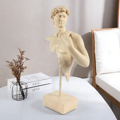 Beige david bust resin sculpture with curly hair and draped fabric on a rectangular base for living room decor