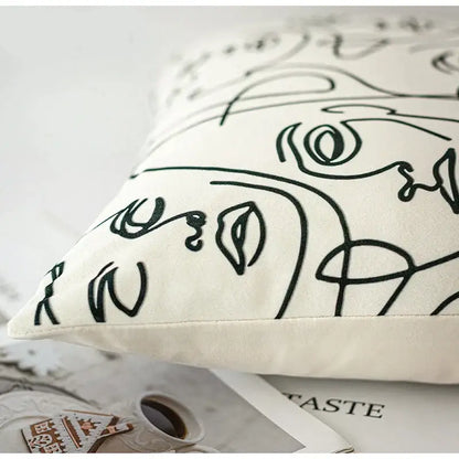Cream-colored beige textured pillow cover with black line-art abstract face design for living room decorbites accents