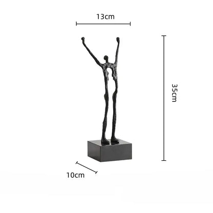 Black abstract human figure sculpture with elongated limbs raised upward on square base for living room decorbites decor