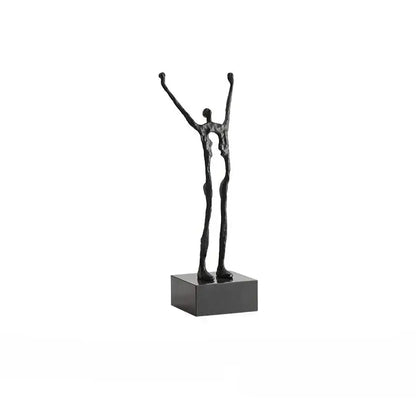Abstract black human figure sculpture featuring two intertwined figures with arms raised for decorbites living room decor