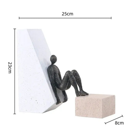 Black abstract gymnast metal handicraft figure seated against white block for living room decorbites decor