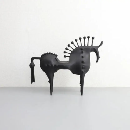 Black matte metal sculpture of a stylized horse with spiky mane and tail decorbites abstract horse decorative figurine