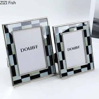 Two elegant black and silver checkered photo frames with a sleek metallic finish for bedroom desktop decorbites black white decor