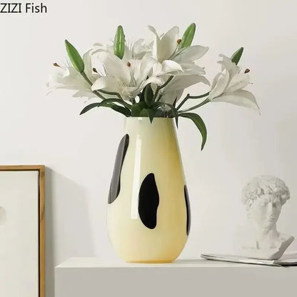 Cream-colored ceramic vase with bold black stripes abstract oval patterns for decorbites black stripes decor