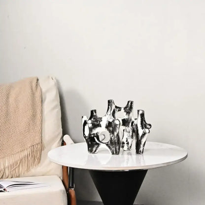 Abstract black and white coral reef piping sculpture in silver ceramic with glossy finish for home decor figurine