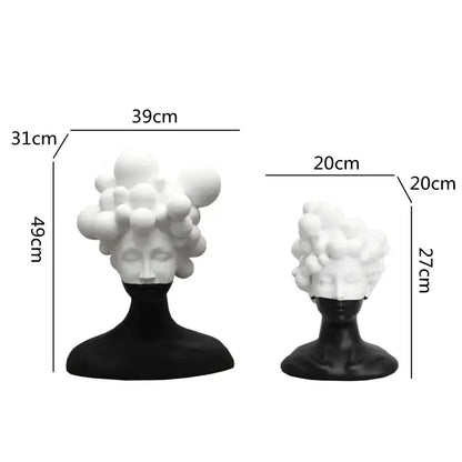 Two minimalist abstract woman figurine resin sculptures with black bodies and white bubble-like hair for living room decorbites decor