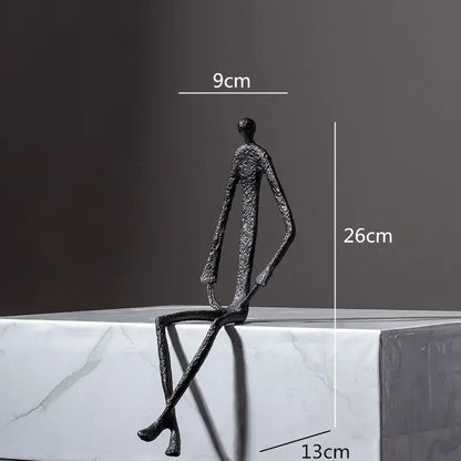 Black textured metal human sculpture with elongated limbs abstract metal human decorbites living room decor