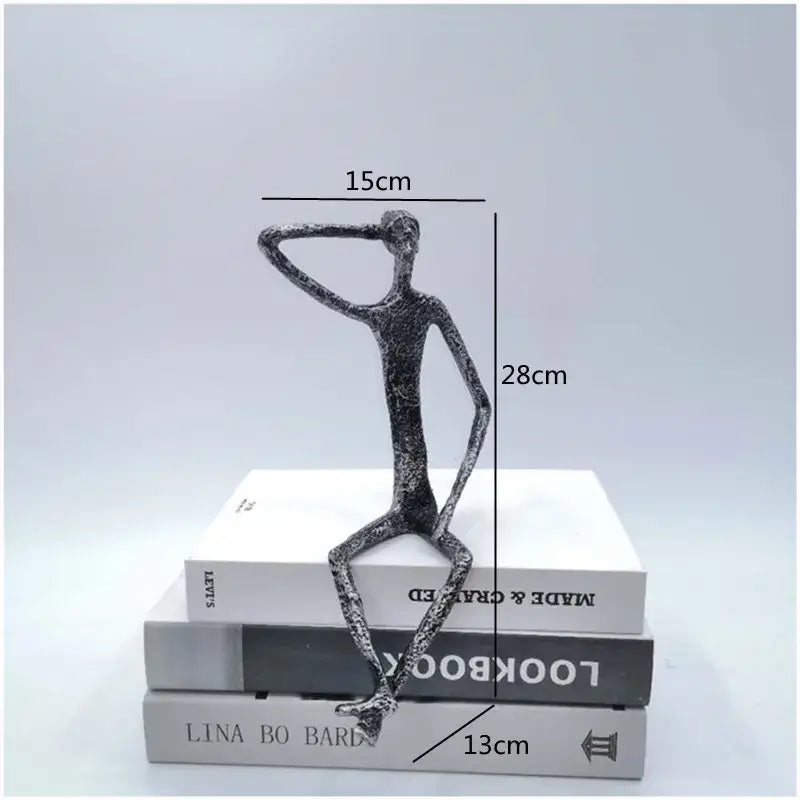 Abstract bronze metal human sculpture with textured finish and elongated limbs for living room decorbites abstract metal decor