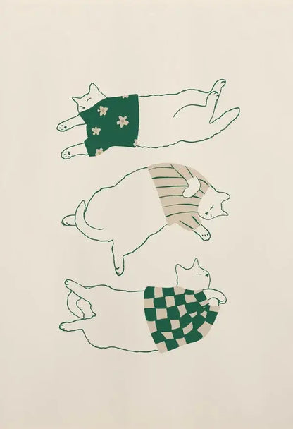 Illustration of three white lazy cats wearing green cream floral, beige stripes, and checkered garments on canvas wall art