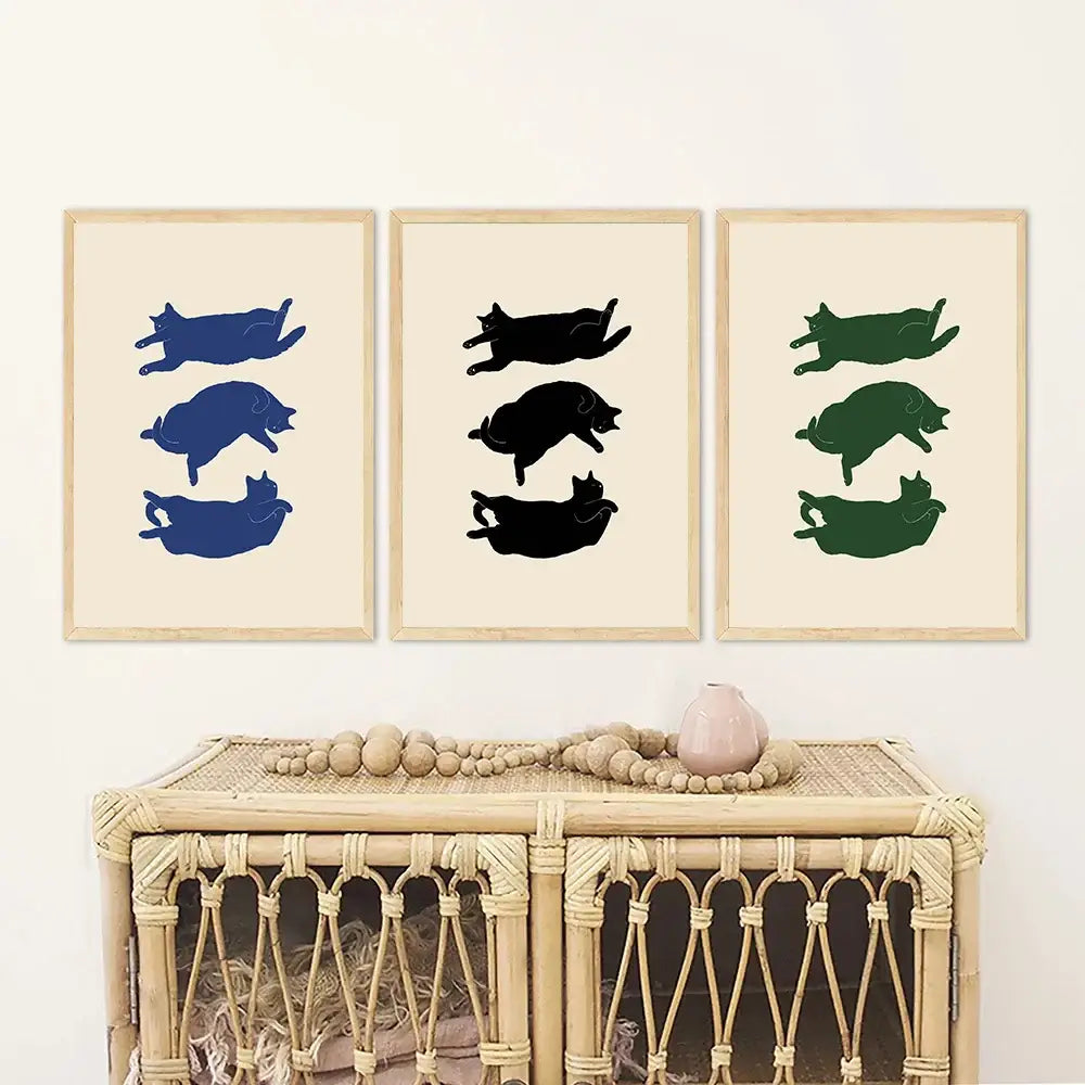 Set of three minimalist framed canvas wall art prints featuring abstract lazy cat illustration in blue black and green