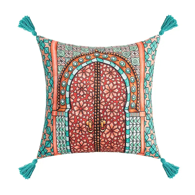 Square cushion cover with vibrant moroccan-style arched door design in coral and teal with tassel decorbites abstract geometric flair