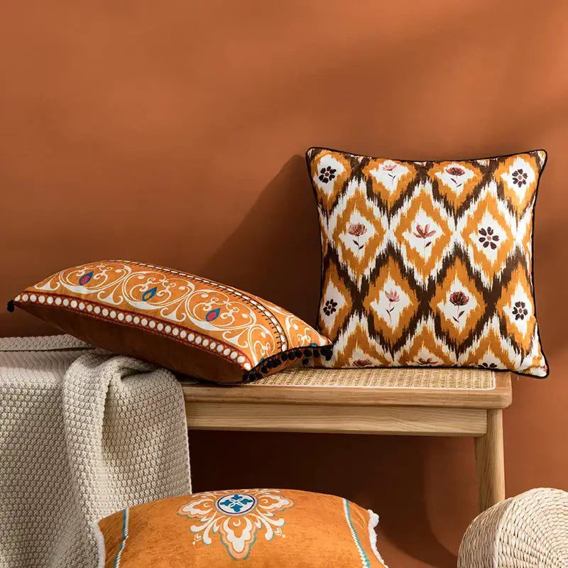 Orange and brown ikat-patterned throw pillows with floral accents for decorbites abstract geometric printed cushion cover