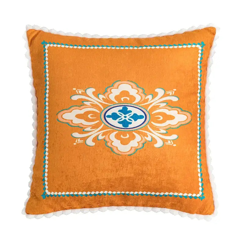 Orange velvet cushion cover with central white and teal floral medallion embroidery for decorbites abstract geometric decor