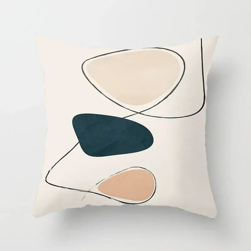 Cream-colored pillow cover with decorbites geometric stitch print featuring abstract shapes in beige teal and dusty rose tones