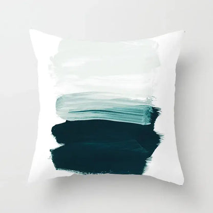 White throw pillow cover with abstract teal and dark green brushstroke design featuring decorbites geometric stitch print decor