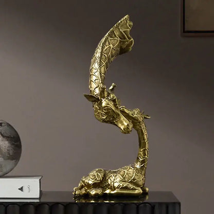 Golden abstract resin giraffe figurine with intricate textured pattern and elegant curved neck for living room decorbites decor