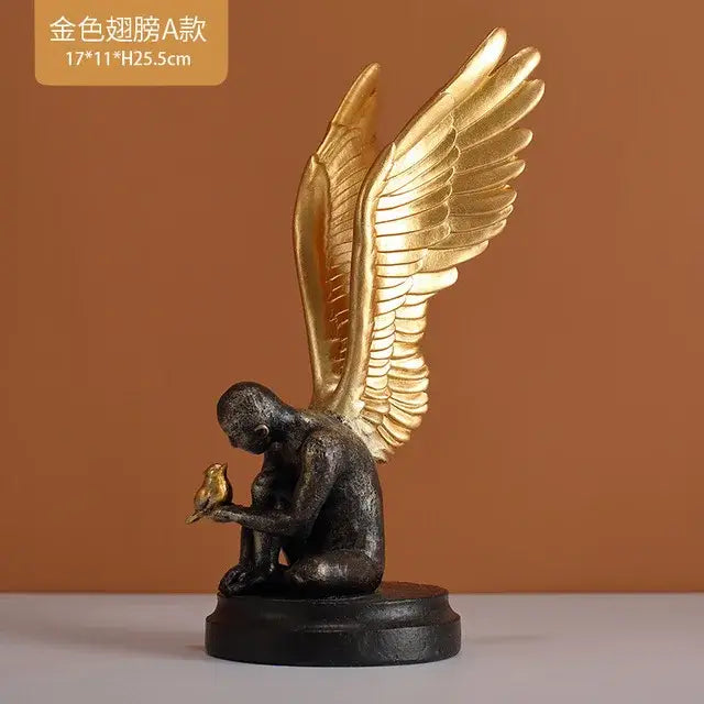 Golden-winged angel figurine with dark bronze body gently holding a small bird decorbites abstract golden resin statue