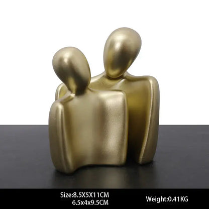 Gold resin statue abstract sculpture of two stylized human figures embracing for living room decor resin statue