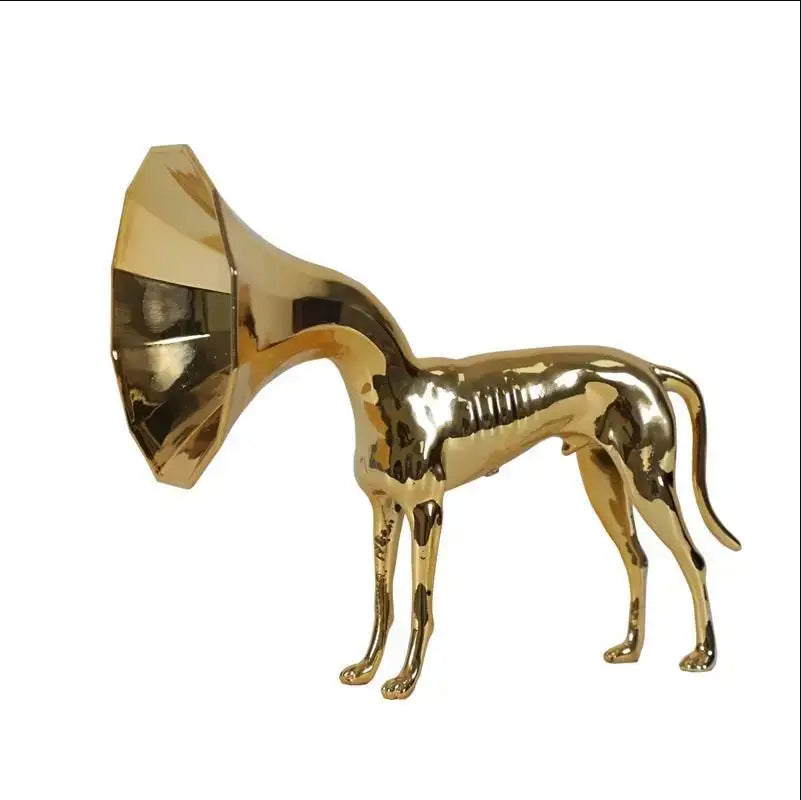 Abstract golden trumpet dog sculpture featuring a metallic golden figurine with a gramophone horn head for living room decor