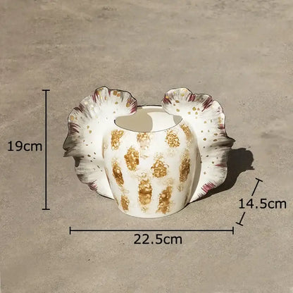 White ceramic butterfly wings vase with gold leaf patterns and fluted petal-like sides for bedroom decor