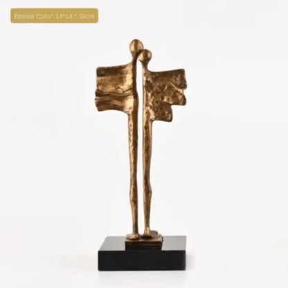 Bronze-colored abstract iron cast couple sculpture on black base for decorbites abstract iron living room decor