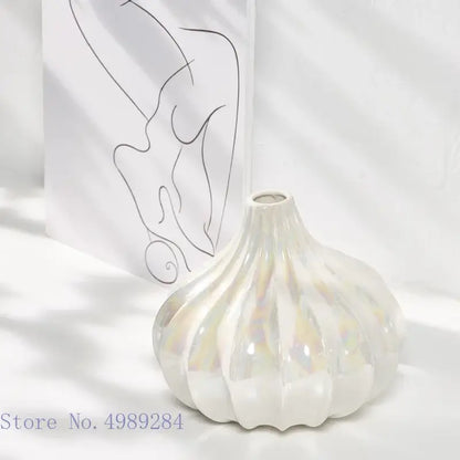 Abstract irregular white decorbites ceramic shell vase with pearlescent fluted design and iridescent finish for living room decor