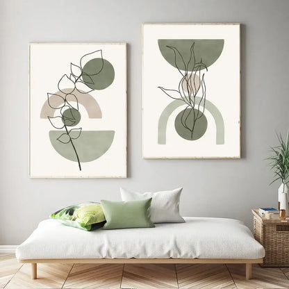 Two framed DecorBites™ abstract geometric canvas paintings with minimalist botanical leaf wall art in muted greens and beige