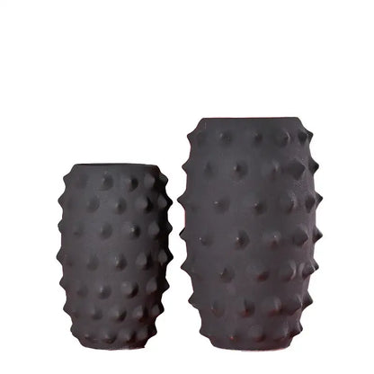 Black ceramic sea urchin vase with textured spiky surface by decorbites ideal for living room decor