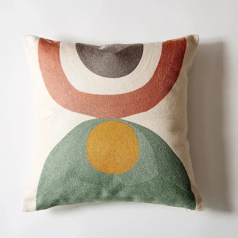Abstract pastel geometric cushion cover with embroidered terracotta arcs and mustard circle on green semicircle decorbites geometric cushion
