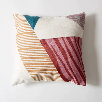Abstract pastel geometric cushion cover featuring a beige teal white and deep red decorbites geometric cushion design