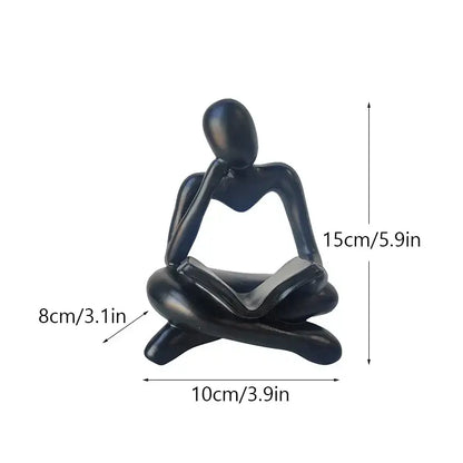 Black glossy resin book figurine of a seated thinker holding an open book for decorbites abstract resin office decor