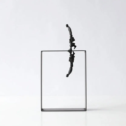 Black metallic resin sculpture of a man carrying a briefcase balanced on a glass frame for living room decorbites abstract resin decor