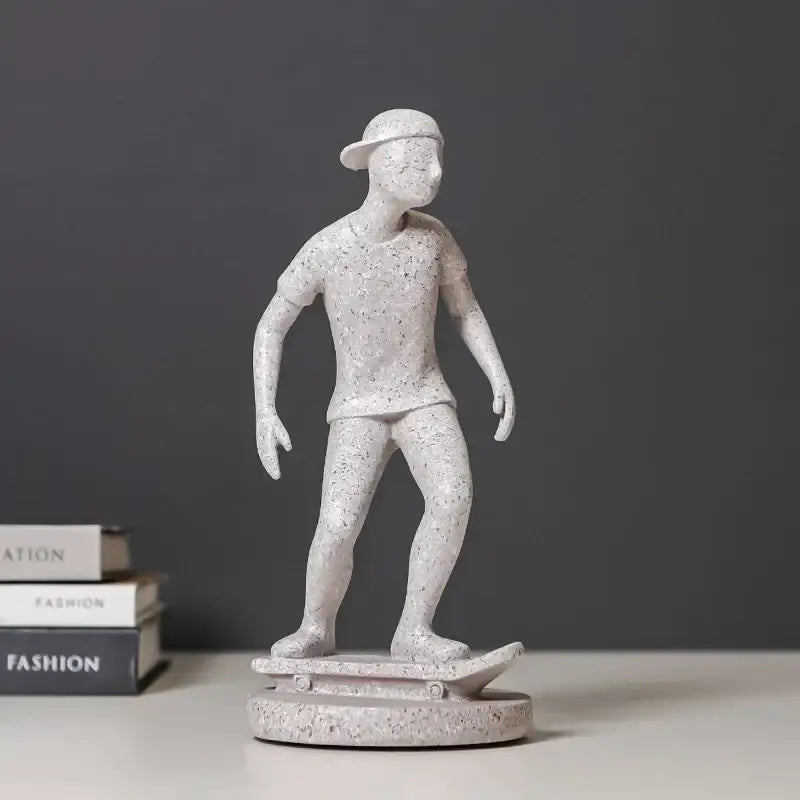 White speckled resin abstract sports player sculpture of skateboarder with cap on matching base for living room decorbites decor