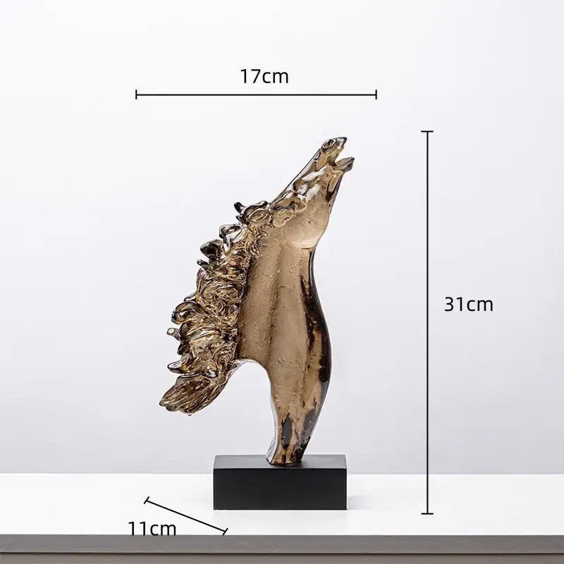 Bronze-colored decorbites horse head statue made of translucent resin with flowing mane on black base for living room decor