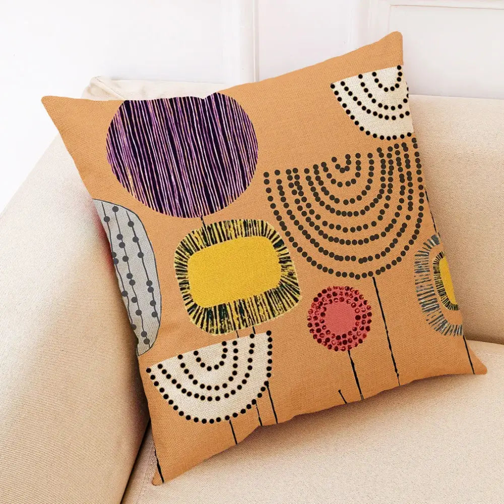 Tan linen pillow cover with abstract tree flower embroidered geometric patterns in purple yellow black white and pink