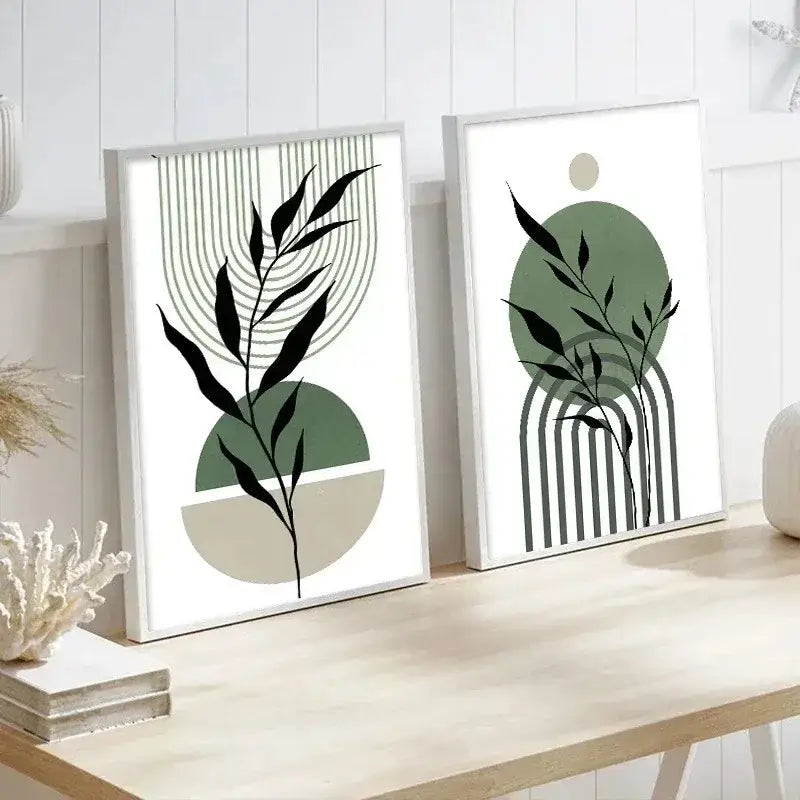Two minimalist framed decorbites™ wall art prints featuring abstract green plants with black leaf silhouettes and geometric shapes