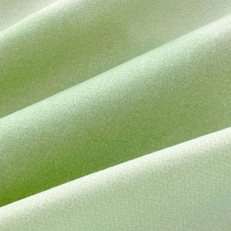 Soft pale green fabric with subtle textured weave on abstract watercolor pastel green and yellow cute pattern duvet cover