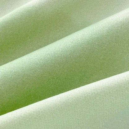 Soft pale green fabric with subtle textured weave on abstract watercolor pastel green and yellow cute pattern duvet cover