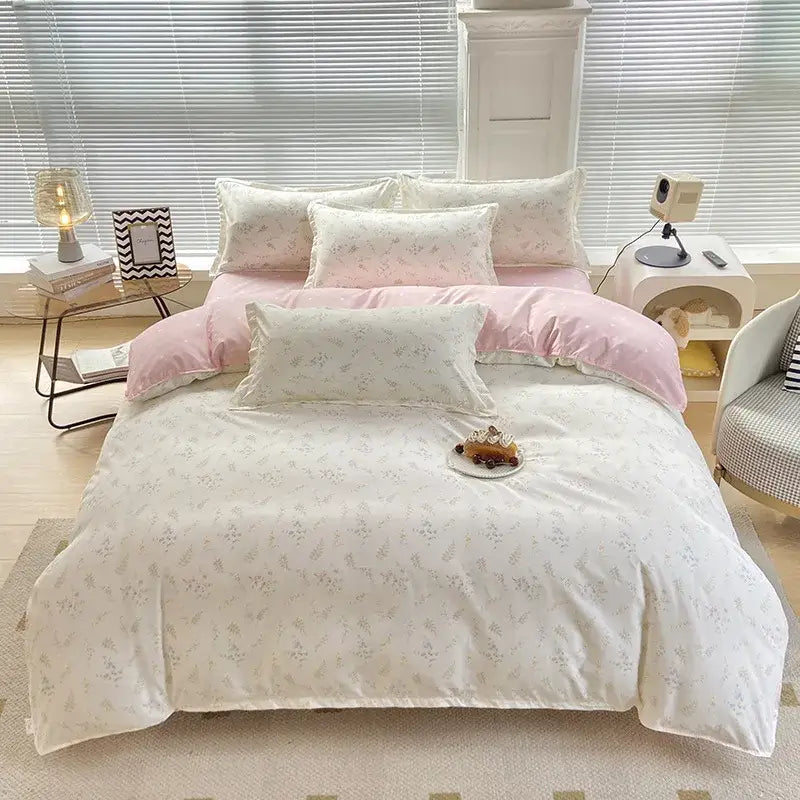 A soft pastel pink and cream floral patterned duvet cover with a decorbites cute pattern for bedroom decor