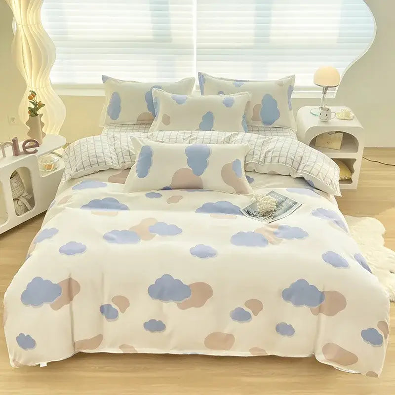 A cozy white duvet cover featuring decorbites cute pattern of pastel blue and beige clouds for bedroom decor